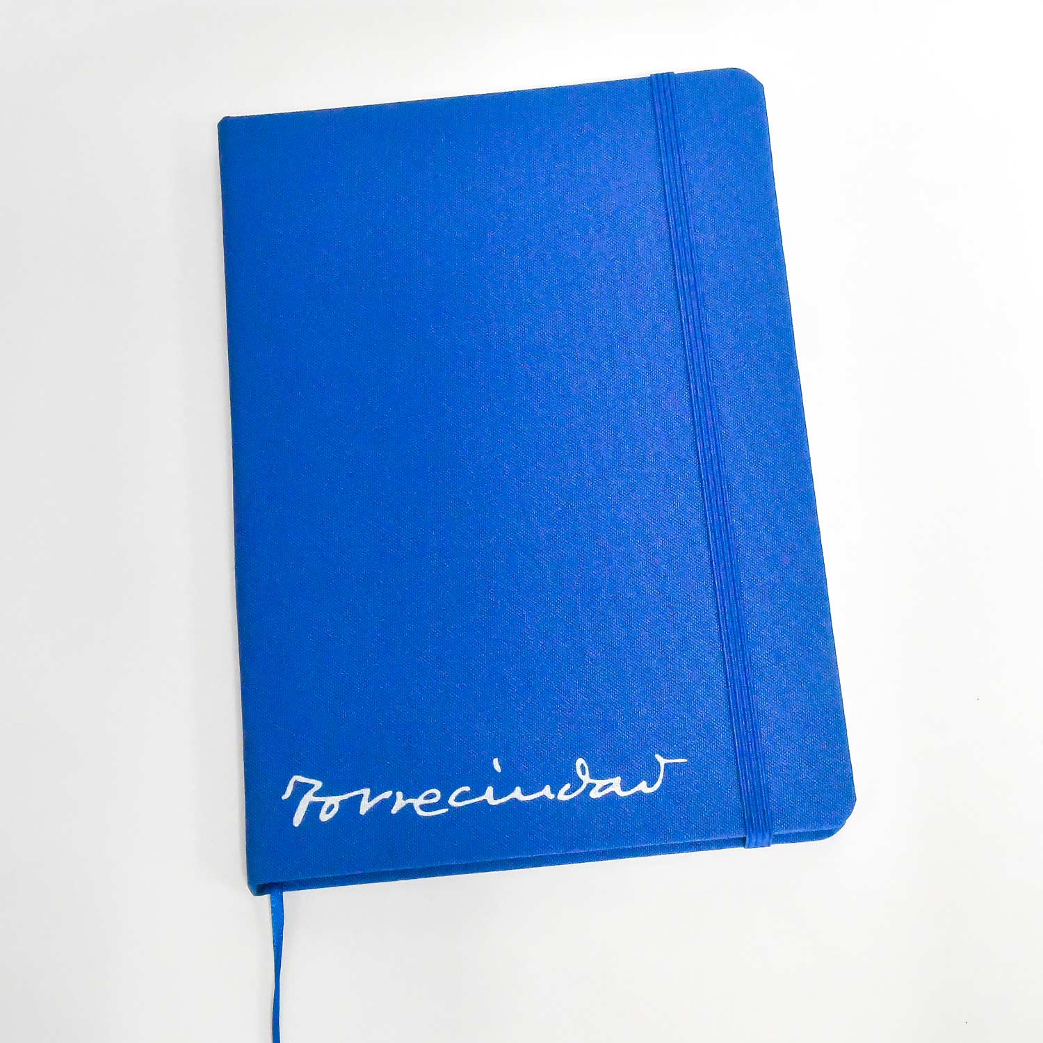 Libreta color azul con tipografía de Torreciudad
